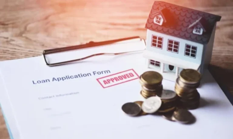 Quantity Surveyors Ireland property cost assessment with approved loan document, house model, and financial planning coins